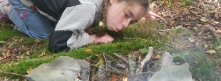 Family Adventure lighting a fire
